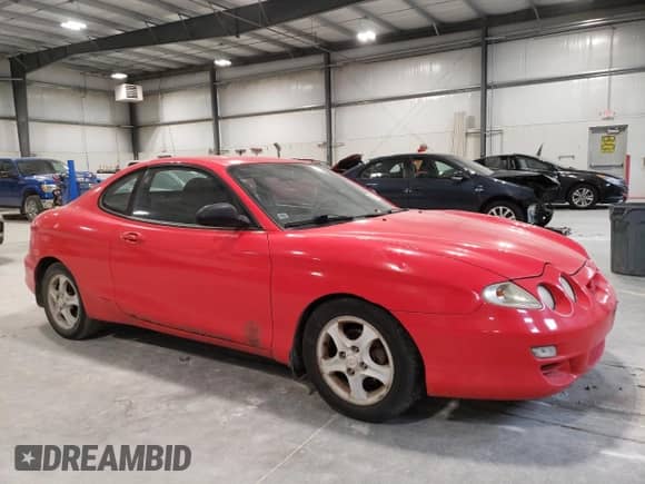 2001 Hyundai Tiburon с VIN KMHJG25F01U226912, выставлен на аукционе Copart как лот 89357135 с пробегом 131 487 миль миль и Чистый • Clean title. История ставок и продаж доступна на DreamBid. Изображение 4.