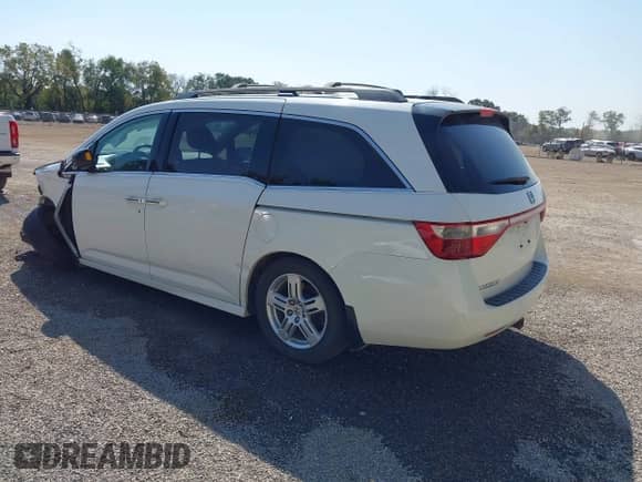 2012 Honda Odyssey Touring with VIN 5FNRL5H9XCB145597, listed as a IAAI auction lot 43247934 with 257,447 mi miles and . Bid and sale history available at DreamBid. Image 3.