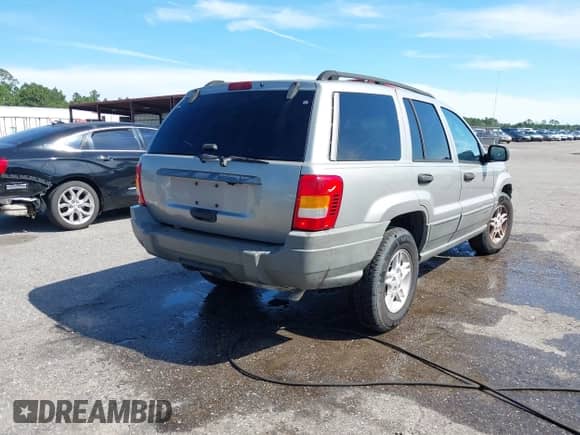 2002 Jeep Grand Cherokee Laredo with VIN 1J4GX48S32C127277, listed as a IAAI auction lot 43125887 with 139,410 mi miles and . Bid and sale history available at DreamBid. Image 4.