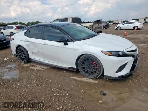 2023 Toyota Camry TRD with VIN 4T1KZ1AK6PU075949, listed as a Copart auction lot 70565865 with 52,356 mi miles and Salvage title. Bid and sale history available at DreamBid. Image 4.