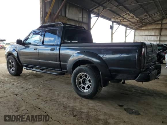 2003 Nissan Frontier SVE with VIN 1N6MD29Y13C412289, listed as a Copart auction lot 49092815 with 192,429 mi miles and Clean title. Bid and sale history available at DreamBid. Image 2.