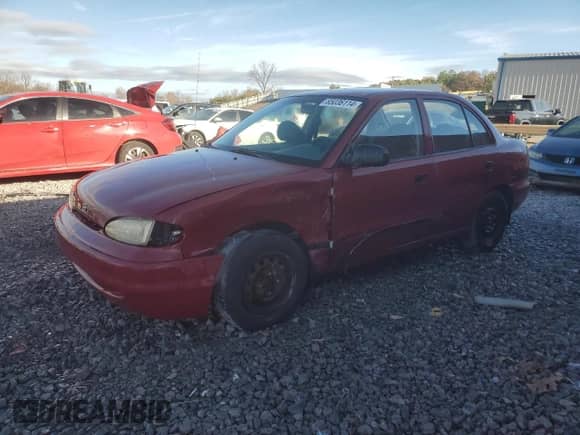1997 Hyundai Accent GL z VIN KMHVF24N5VU369924, wystawiony jako Copart lot #85036114 z przebiegiem 168 797 mil mil oraz Szkoda całkowita • Salvage title. Historia ofert i sprzedaży dostępna na DreamBid. Obrazek 1.