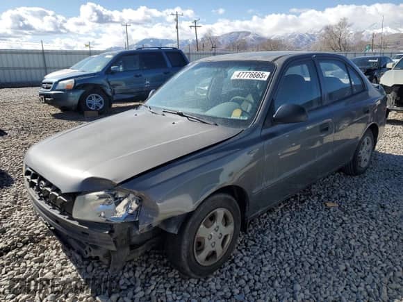 2002 Hyundai Accent GL z VIN KMHCG45C22U336484, wystawiony jako Copart lot #47776665 z przebiegiem 184 346 mil mil oraz Szkoda całkowita • Salvage title. Historia ofert i sprzedaży dostępna na DreamBid. Obrazek 1.