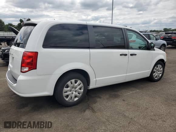2020 Dodge Grand Caravan SE z VIN 2C4RDGBG3LR221701, wystawiony jako Copart lot #69607015 z przebiegiem 24 580 mil mil oraz Szkoda całkowita • Salvage title. Historia ofert i sprzedaży dostępna na DreamBid. Obrazek 3.