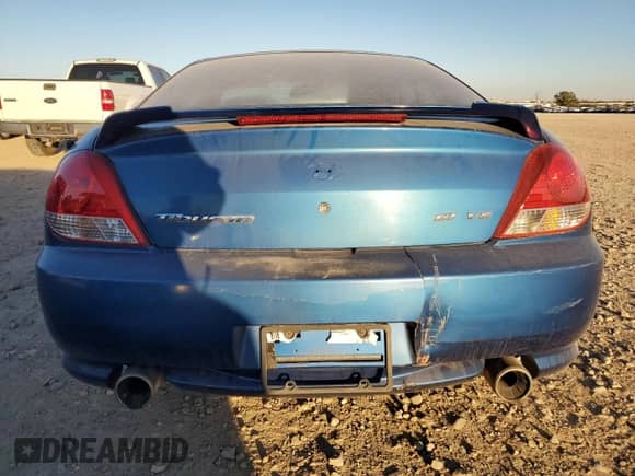 2005 Hyundai Tiburon GT with VIN KMHHN65F35U186438, listed as a Copart auction lot 41879955 with 152,574 mi miles and Salvage title. Bid and sale history available at DreamBid. Image 6.