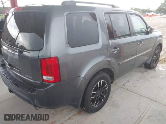 2010 Honda Pilot Touring z VIN 5FNYF3H93AB004598, wystawiony jako IAAI lot #42755136 z przebiegiem 187 990 mil mil oraz . Historia ofert i sprzedaży dostępna na DreamBid. Obrazek 4.