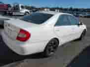 2002 Toyota Camry XLE with VIN JTDBF30K820001796, listed as a IAAI auction lot 43399201 with 235,451 mi miles and . Bid and sale history available at DreamBid. Image 4.