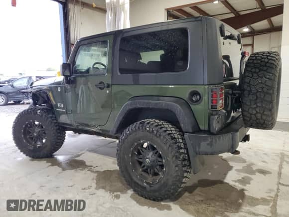 2009 Jeep Wrangler X с VIN 1J4FA24169L708281, выставлен на аукционе Copart как лот 85533845 с пробегом 83 553 миль миль и Списание • Salvage title. История ставок и продаж доступна на DreamBid. Изображение 2.