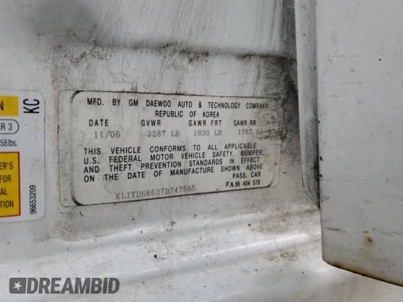 2007 Chevrolet Aveo LS z VIN KL1TD66637B747565, wystawiony jako Copart lot #55832745 z przebiegiem 133 082 mil mil oraz Szkoda całkowita • Salvage title. Historia ofert i sprzedaży dostępna na DreamBid. Obrazek 13.