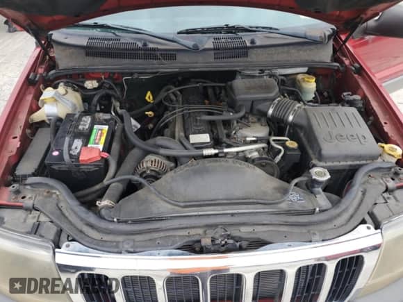 2002 Jeep Grand Cherokee Sport with VIN 1J4GW38S32C272381, listed as a Copart auction lot 69071265 with 129,522 mi miles and Non repairable. Bid and sale history available at DreamBid. Image 12.