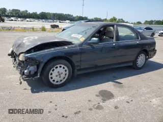 1997 Honda Accord EX with VIN 1HGCD555XVA005843, listed as a Copart auction lot 65820844 with 258,212 mi miles and Salvage title. Bid and sale history available at DreamBid. Image 1.