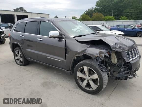 2015 Jeep Grand Cherokee Overland с VIN 1C4RJECT7FC629477, выставлен на аукционе Copart как лот 55810215 с пробегом 154 990 миль миль и Списание • Salvage title. История ставок и продаж доступна на DreamBid. Изображение 4.