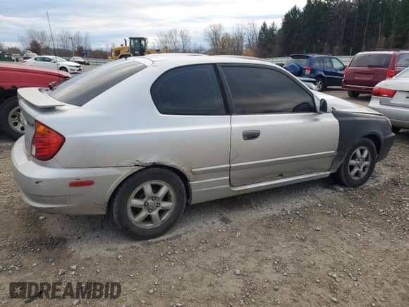 2004 Hyundai Accent GL z VIN KMHCG35C64U279929, wystawiony jako Copart lot #81661824 z przebiegiem 99 222 mil mil oraz Szkoda całkowita • Salvage title. Historia ofert i sprzedaży dostępna na DreamBid. Obrazek 3.