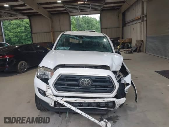 2018 Toyota Tacoma SR5 with VIN 5TFRZ5CN2JX058282, listed as a IAAI auction lot 42633438 with 94,071 mi miles and . Bid and sale history available at DreamBid. Image 12.
