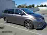 2015 Toyota Sienna SE with VIN 5TDXK3DC6FS622851, listed as a Copart auction lot 82207425 with 112,162 mi miles and Salvage title. Bid and sale history available at DreamBid. Image 4.