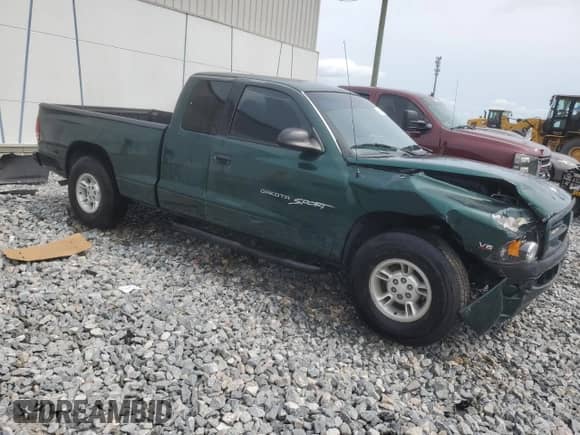 1999 Dodge Dakota SLT with VIN 1B7GL22X8XS283614, listed as a Copart auction lot 59412515 with 69,705 mi miles and Salvage title. Bid and sale history available at DreamBid. Image 4.