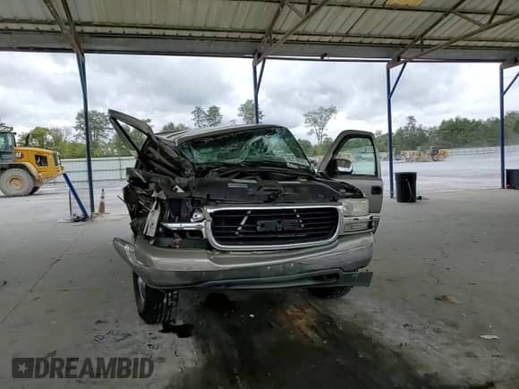 2001 GMC Sierra 1500 SLE z VIN 1GTEK19T31E144505, wystawiony jako Copart lot #85718505 z przebiegiem Nie podano mil oraz Szkoda całkowita • Salvage title. Historia ofert i sprzedaży dostępna na DreamBid. Obrazek 13.