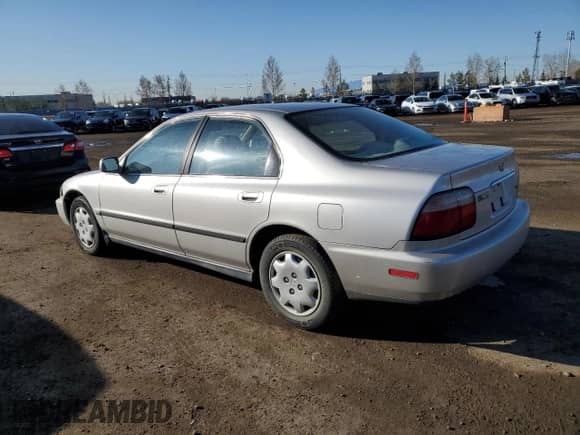 1997 Honda Accord LX with VIN 1HGCD5630VA809341, listed as a Copart auction lot 54182105 with 223,707 mi miles and Salvage title. Bid and sale history available at DreamBid. Image 2.
