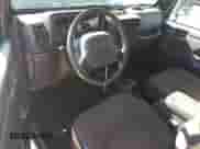 2000 Jeep Wrangler Sport with VIN 1J4FA49S1YP796600, listed as a Copart auction lot 82574545 with 128,340 mi miles and Clean title. Bid and sale history available at DreamBid. Image 8.