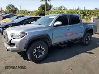 2020 Toyota Tacoma SR5 with VIN 3TMCZ5AN0LM315893, listed as a Copart auction lot 62214955 with 127,201 mi miles and Salvage title. Bid and sale history available at DreamBid. Image 1.