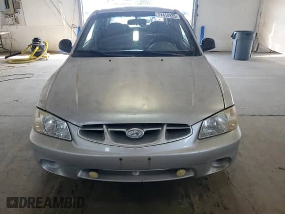 2002 Hyundai Accent GS z VIN KMHCG35C32U190168, wystawiony jako Copart lot #71414935 z przebiegiem 205 445 mil mil oraz Szkoda całkowita • Salvage title. Historia ofert i sprzedaży dostępna na DreamBid. Obrazek 5.