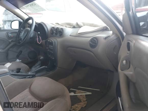 2001 Pontiac Grand Am SE z VIN 1G2NE52T81M582634, wystawiony jako IAAI lot #42652160 z przebiegiem Nie podano mil oraz . Historia ofert i sprzedaży dostępna na DreamBid. Obrazek 5.