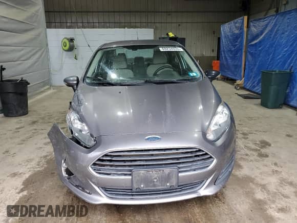 2014 Ford Fiesta SE with VIN 3FADP4BJ8EM194670, listed as a Copart auction lot 69234035 with 106,806 mi miles and Salvage title. Bid and sale history available at DreamBid. Image 5.