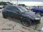 2009 Subaru WRX STI with VIN JF1GR89639L803560, listed as a Copart auction lot 56156594 with 87,680 mi miles and Salvage title. Bid and sale history available at DreamBid. Image 4.