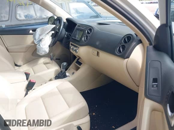 2015 Volkswagen Tiguan S with VIN WVGAV7AX8FW567004, listed as a IAAI auction lot 43396121 with 109,393 mi miles and . Bid and sale history available at DreamBid. Image 5.