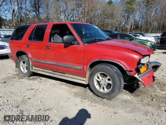 1999 Chevrolet Blazer LS with VIN 1GNDT13W6XK227357, listed as a Copart auction lot 46644235 with 228,532 mi miles and Salvage title. Bid and sale history available at DreamBid. Image 4.