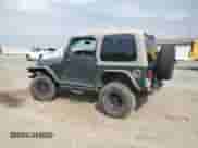 2003 Jeep Wrangler Rubicon с VIN 1J4FA69S43P327618, выставлен на аукционе Copart как лот 70574135 с пробегом 111 917 миль миль и Списание • Salvage title. История ставок и продаж доступна на DreamBid. Изображение 2.