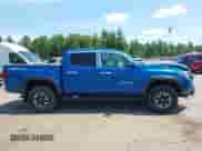 2018 Toyota Tacoma SR z VIN 3TMCZ5AN0JM126724, wystawiony jako IAAI lot #42842788 z przebiegiem 91 776 mil mil oraz . Historia ofert i sprzedaży dostępna na DreamBid. Obrazek 13.