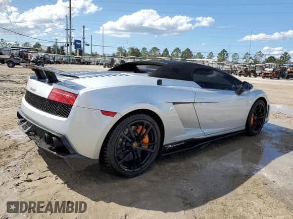 2013 Lamborghini Gallardo с VIN ZHWGU8AJ7DLA12671, выставлен на аукционе Copart как лот 75721804 с пробегом 14 849 миль миль и На запчасти • Non repairable. История ставок и продаж доступна на DreamBid. Изображение 3.