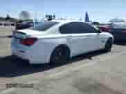 2013 BMW 7 Series 750i with VIN WBAYA8C54DC996412, listed as a Copart auction lot 56982895 with 124,258 mi miles and Salvage title. Bid and sale history available at DreamBid. Image 3.