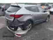 2018 Hyundai Santa Fe 2.4L z VIN 5XYZTDLB4JG526856, wystawiony jako IAAI lot #42998185 z przebiegiem 106 919 mil mil oraz . Historia ofert i sprzedaży dostępna na DreamBid. Obrazek 4.