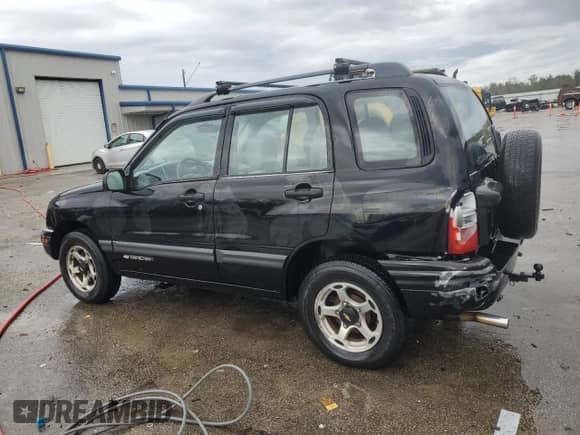2000 Chevrolet Tracker with VIN 2CNBJ13C2Y6908949, listed as a Copart auction lot 79817914 with 212,369 mi miles and Salvage title. Bid and sale history available at DreamBid. Image 2.