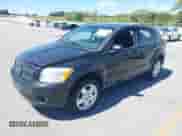 2009 Dodge Caliber SXT with VIN 1B3HB48A59D183646, listed as a IAAI auction lot 43048308 with 152,808 mi miles and . Bid and sale history available at DreamBid. Image 2.
