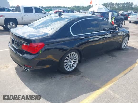 2011 BMW 7 Series 750Li xDrive with VIN WBAKC8C54BC431851, listed as a IAAI auction lot 42216519 with 106,022 mi miles and . Bid and sale history available at DreamBid. Image 4.