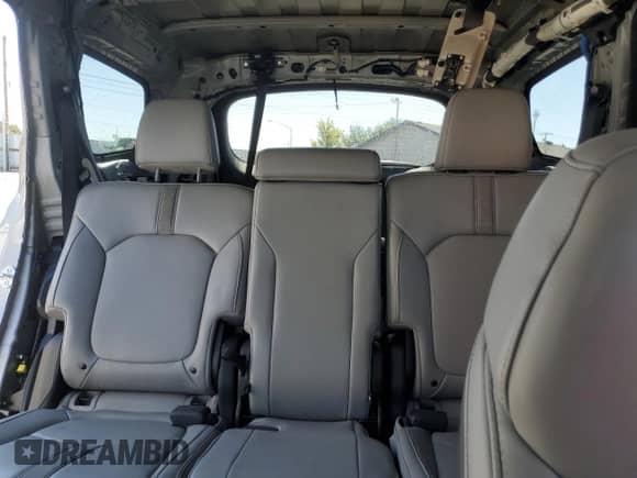 2024 Honda Pilot Touring with VIN 5FNYG1H73RB036382, listed as a Copart auction lot 69703235 with 30,329 mi miles and Salvage title. Bid and sale history available at DreamBid. Image 10.