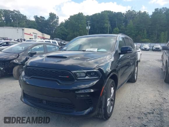 2023 Dodge Durango Hemi Orange with VIN 1C4SDHCT0PC635715, listed as a IAAI auction lot 42943681 with 50,044 mi miles and . Bid and sale history available at DreamBid. Image 2.