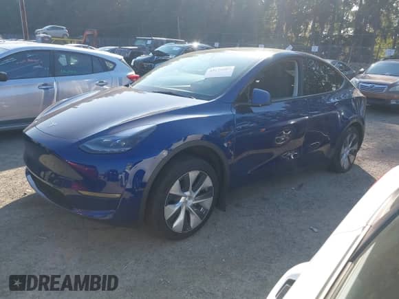 2023 Tesla Model Y Long Range with VIN 7SAYGDEE3PF957974, listed as a IAAI auction lot 43275987 with 20,712 mi miles and . Bid and sale history available at DreamBid. Image 19.
