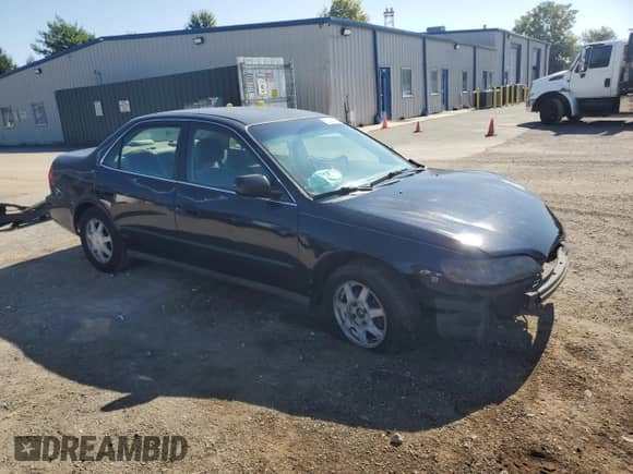 2000 Honda Accord LX с VIN 1HGCG6652YA142596, выставлен на аукционе Copart как лот 80483945 с пробегом 376 012 миль миль и Списание • Salvage title. История ставок и продаж доступна на DreamBid. Изображение 4.