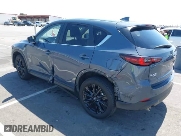 2022 Mazda CX-5 S Carbon Edition z VIN JM3KFBCM7N1601447, wystawiony jako IAAI lot #42463014 z przebiegiem 37 126 mil mil oraz . Historia ofert i sprzedaży dostępna na DreamBid. Obrazek 3.