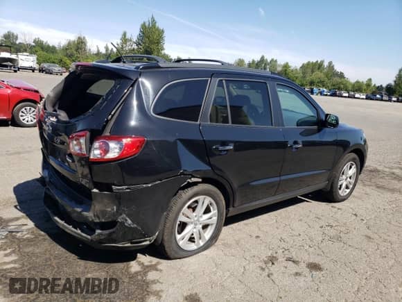 2012 Hyundai Santa Fe Limited with VIN 5XYZKDAG5CG121643, listed as a Copart auction lot 65456965 with 147,697 mi miles and Salvage title. Bid and sale history available at DreamBid. Image 3.
