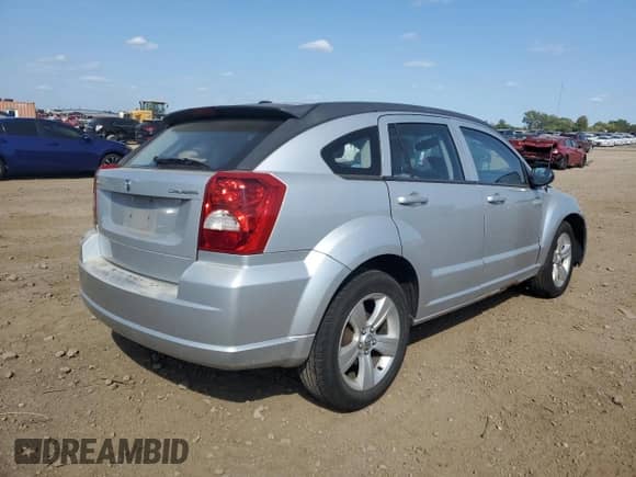 2010 Dodge Caliber Mainstreet with VIN 1B3CB3HA3AD648594, listed as a Copart auction lot 71647135 with 94,206 mi miles and Salvage title. Bid and sale history available at DreamBid. Image 3.