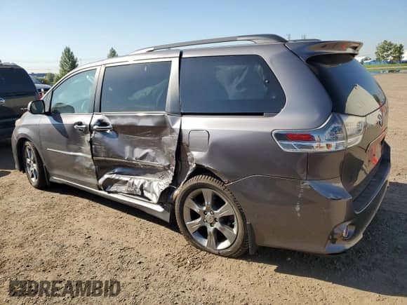 2011 Toyota Sienna SE with VIN 5TDXK3DC0BS077515, listed as a Copart auction lot 70179025 with 220,045 mi miles and Salvage title. Bid and sale history available at DreamBid. Image 2.