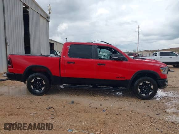 2022 Ram 1500 Rebel z VIN 1C6SRFLTXNN362961, wystawiony jako IAAI lot #42605488 z przebiegiem 121 529 mil mil oraz . Historia ofert i sprzedaży dostępna na DreamBid. Obrazek 13.