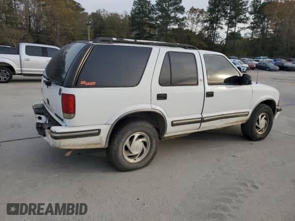 1999 Chevrolet Blazer LT z VIN 1GNDT13W1X2163194, wystawiony jako Copart lot #82897414 z przebiegiem Nie podano mil oraz Szkoda całkowita • Salvage title. Historia ofert i sprzedaży dostępna na DreamBid. Obrazek 3.
