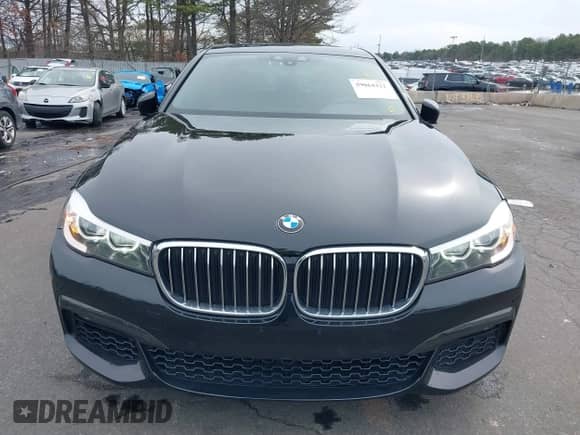 2019 BMW 7 Series 740i with VIN WBA7E2C57KB217973, listed as a IAAI auction lot 39064321 with 54,818 mi miles and . Bid and sale history available at DreamBid. Image 12.