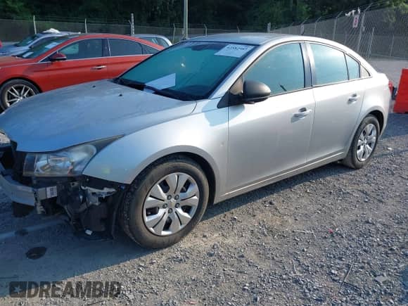 2014 Chevrolet Cruze LS with VIN 1G1PB5SG2E7272993, listed as a IAAI auction lot 42582987 with 156,816 mi miles and . Bid and sale history available at DreamBid. Image 2.